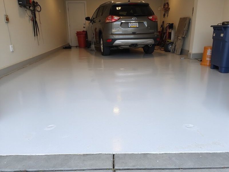 Wide-angle view of a completed foam leveling project showing smooth level concrete surface in a Colorado Springs garage